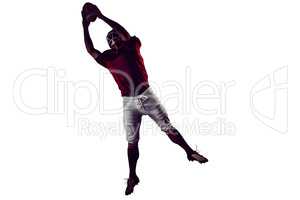 American football player catching football