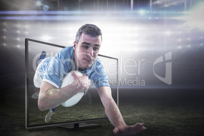 Composite image of a rugby player scoring a try