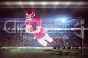 Composite image of american football player scoring a touchdown