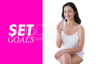 Composite image of woman drinking water