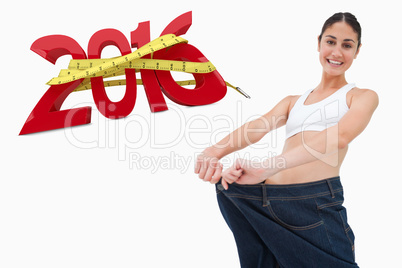 Composite image of brunette in a jeans too big