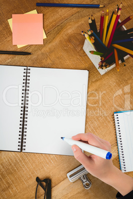 Composite image of businesswomans hand writing with marker
