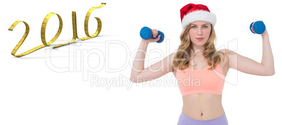 Composite image of festive fit blonde holding dumbbells