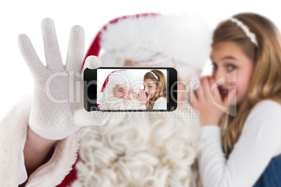 Composite image of hand holding mobile phone