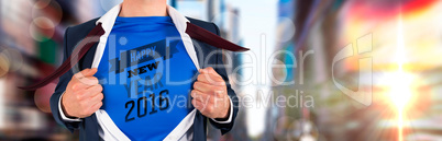 Composite image of businessman opening his shirt superhero style