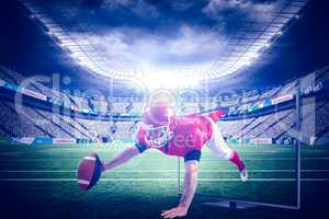 Composite image of american football player reaching football