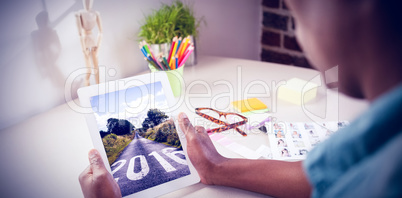 Composite image of photo editor using tablet pc Composite image of photo editor using tablet pc