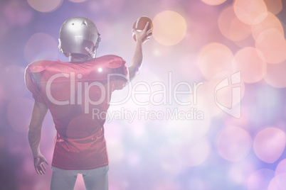 Composite image of rear view of sportsman in red jersey holding