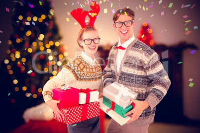 Composite image of smiling woman wearing red reindeer horn and h