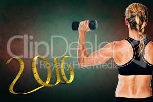 Composite image of female bodybuilder holding a blue dumbbell