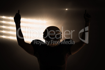 Composite image of silhouette american football player with thum