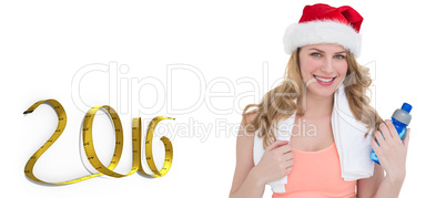 Composite image of festive fit blonde holding bottle of water
