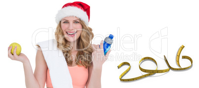 Composite image of festive fit blonde smiling at camera