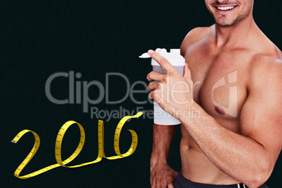 Composite image of bodybuilder holding flask