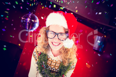 Composite image of geeky hipster smiling at camera