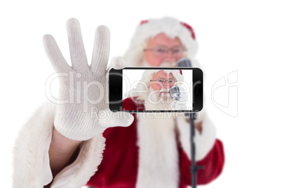 Composite image of hand holding mobile phone