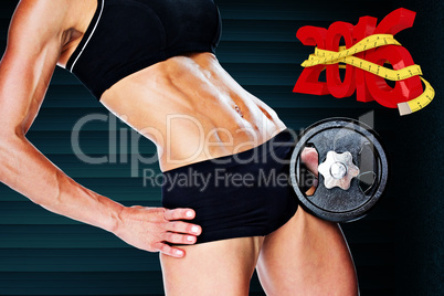 Composite image of female bodybuilder holding large black dumbbe