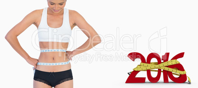Composite image of smiling slim woman measuring her waist
