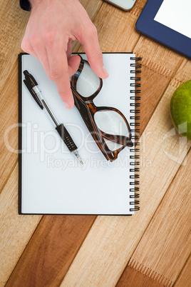 Composite image of businessman measuring something with these fi