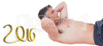 Composite image of fit man doing sit ups with no shirt on