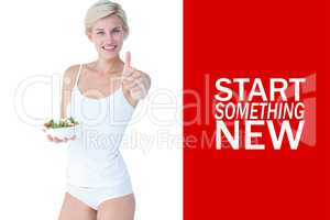 Composite image of beautiful fit woman holding a bowl of salad w