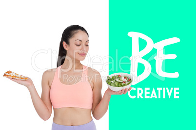 Composite image of smiling brunette looking at salad while holdi