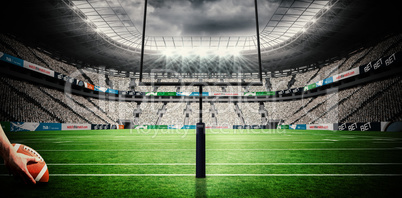 Composite image of american football player preparing for a drop