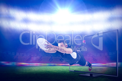 Composite image of rugby player scoring a try