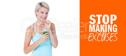 Composite image of beautiful woman drinking green juice