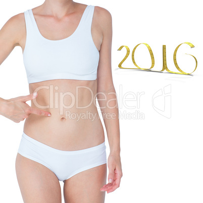 Composite image of attractive woman pointing her belly
