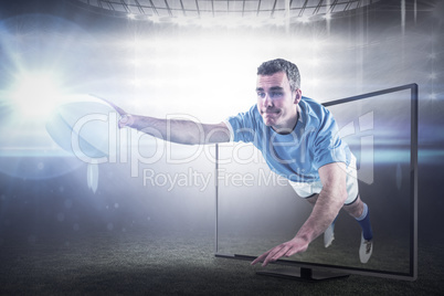 Composite image of a rugby player scoring a try