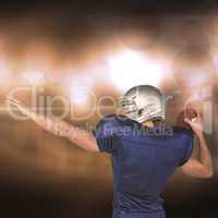 Composite image of rear view of american football player throwin