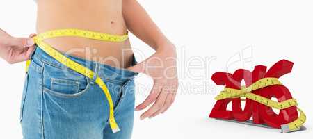 Composite image of mid section of woman measuring waist in a big