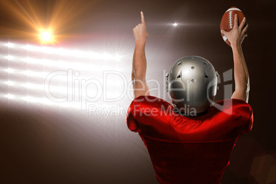 Composite image of rear view of american football player with ar