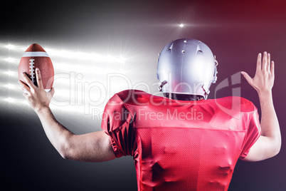 Composite image of rear view of american football player gesturi