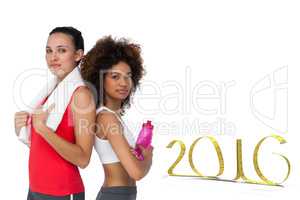 Composite image of fit women standing with waterbottle and towel