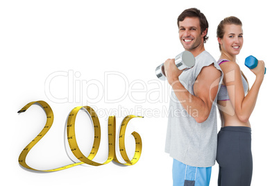 Composite image of portrait of a fit couple exercising with dumb