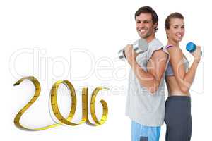 Composite image of portrait of a fit couple exercising with dumb