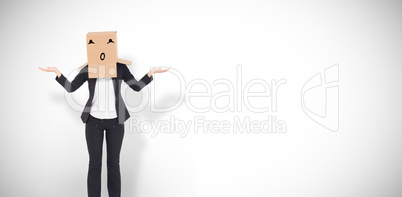 Composite image of businesswoman with box over head