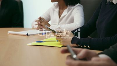 2 People In Office Meeting Room Texting On Phone