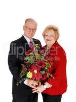 Closeup of senior couple with flowers.