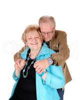 Senior man hugging his wife.