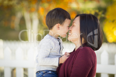 Chinese Mom Having Fun and Holding Her Mixed Race Boy