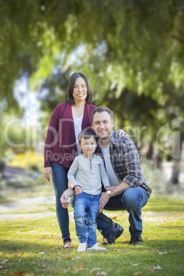 Mixed Race Young Family Portrait Outdoors