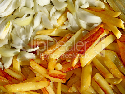 Fried potato chips and cutting onions
