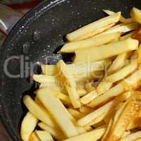 Roasted potato chips in a frying pan