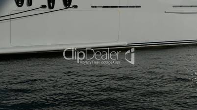 The vertical panning of modern yacht with helicopter on top in yacht marina, Birgu, Malta