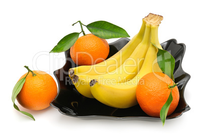 Tangerines and banana in plate