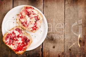 Raspberry jam on whole grain rolls