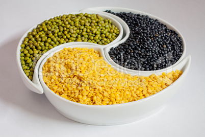 Multicolored beans in ceramics bowl